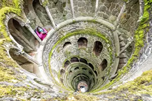 Towers Prints: Photographer at the top of the spiral stairs inside the towers of Initiation Well