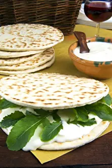 Traditional Food Prints: Piadina flat bread with rucola (rocket) and stracchino cheese, typical Emilia Romagna food