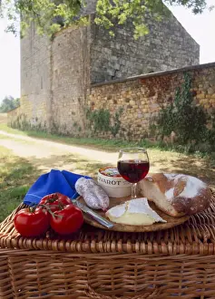 Dairy Prints: Picnic lunch of bread, cheese, tomatoes and red wine on a hamper in the Dordogne