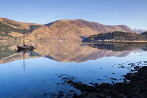 Loch Leven Prints: Picturesque tranquil Loch Leven with sailing boat and reflection from Glen Coe village
