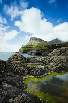 Cascading Prints: The picturesque village of Gasadalur which is overlooked by the 612m Heinanova mountain