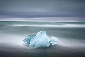 Glacial Prints: Piece of glacial ice washed ashore by the incoming tide near glacial lagoon at Jokulsarlon