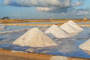 Trapani Province Prints: Piles of salts among salt flats with windmills in the background at sunset