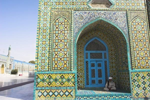Pilgrim sits in a niche at the Shrine of Hazrat Ali, who was assassinated in 661