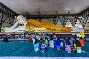 Females Prints: Pilgrims praying before a reclining Buddha, Su Taung Pyi pagoda, Myitkyina, Kachin state