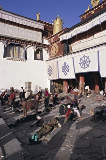 Bowing Prints: Pilgrims prostrating outside the Jokhang Temple, Lhasa, Tibet, China, Asia