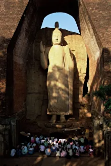 Sinelese Prints: Pilgrims seated in front of the 39 ft high standing Buddha