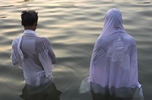 Puja Prints: Two pilgrims in white dress making Puja celebration