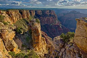 Pillars of rock standing just away from the cliff of the Grand Canyon south of Zuni
