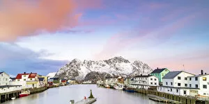 Nordland Gallery: Pink Arctic sunrise over traditional houses in the fishing village of Henningsvaer in winter