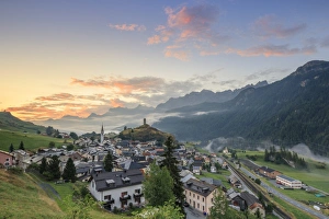Typically Swiss Prints: Pink clouds at dawn on the alpine village of Ardez, canton of Graub?nden, district of Inn