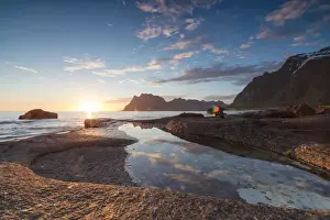 Uttakleiv Prints: Pink clouds and midnight sun are reflected in the blue sea framed by rocky peaks