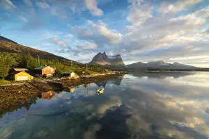 Traditionally Norwegian Prints: Pink clouds of midnight sun reflected in the clear water of blue sea, Anepollen Fjord
