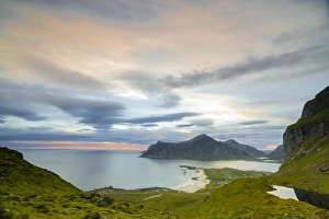 Nordland County Gallery: Pink clouds of the midnight sun reflected in the cold sea, Flakstad, Moskenesoya