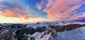 Odle Prints: Pink clouds in the sky at sunset over Gran Cir and Odle mountains covered with snow in