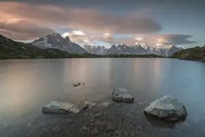 Massif Prints: Pink clouds at sunrise on Mont Blanc massif seen from Lacs De Cheserys, Chamonix