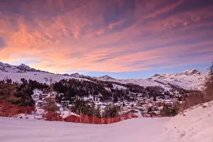 Ski Resort Prints: Pink clouds at sunset on the alpine village of Madesimo and the snowy ski slopes