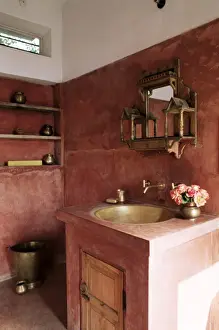 Amber Prints: Pink finished plaster walls and hand beaten brass bathroom sink
