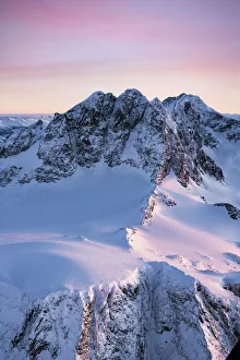 Valtellina Prints: Pink sky at dawn over the snowcapped Piz Roseg, Piz Scerscen and Piz Bernina, aerial view