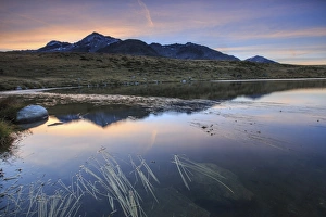 Pink Sky Prints: Pink sky on Peak Emet reflected in Lake Andossi at dawn, Chiavenna Valley, Spluga Valley