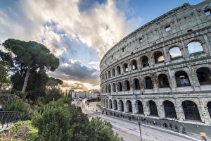The pink sky at sunrise frames the ancient Colosseum (Flavian Amphitheatre), UNESCO The pink sky at sunrise frames the ancient Colosseum (Flavian Amphitheatre), UNESCO