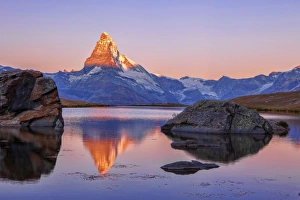 Pink Prints: Pink sky at sunrise on the Matterhorn reflected in Stellisee, Zermatt, Canton of Valais