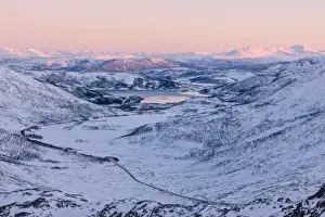 Pink Sky Prints: Pink sky at sunset on the snowy landscape and frozen sea surrounding Fjordbotn, Lysnes