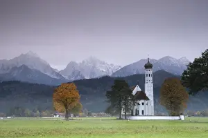 Schwangau Prints: Pink sunrise on St. Coloman Church surrounded by woods and mist of autumn, Schwangau