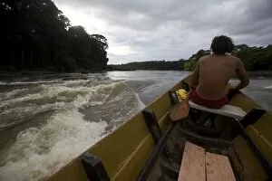 Pirogue in the rapids of the Approuague River, French Guiana, South America