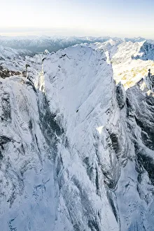 Graubunden Prints: Pizzo Badile covered with snow after a winter blizzard, aerial view, Val Bregaglia