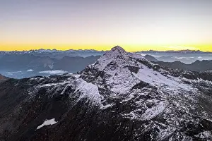 Sondrio Prints: Pizzo Scalino peak covered with snow at dawn in autumn