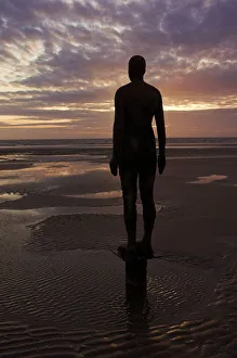 Another Place statues by artist Antony Gormley on Crosby beach, Merseyside