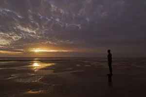Skies Prints: Another Place statues by artist Antony Gormley on Crosby beach, Merseyside
