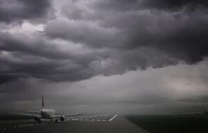 Images Dated 6th November 2009: Plane ready for take off and stormy skies, Heathrow Airport, London, England