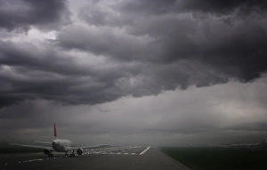 Images Dated 6th November 2009: Plane ready for take off and stormy skies, Heathrow Airport, London, England