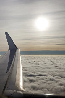 Airplane Prints: Plane wing with low lying clouds and sunburst, United Kingdom, Europe