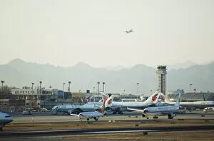 Planes taking off and taxi-ing on the runway at Beijing Capital Airport part of new Terminal 3 building opened February