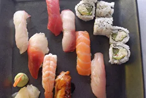 Food And Drink Prints: Plate of sushi covered with raw fish and stuffed