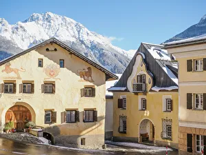 Wintry Prints: A plaza in the Alpine village of Sent in winter, Graubunden, Switzerland, Europe