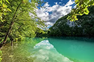 Fresh Prints: Plitvice Lakes National Park shows turquoise water and green trees in Croatia