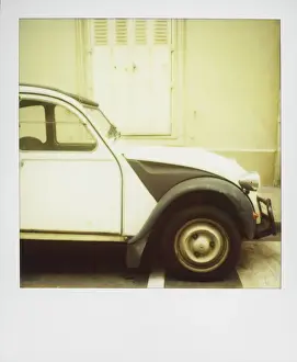 Pari Prints: Polaroid of old black and white Citroen 2CV parked on street, Paris, France, Europe