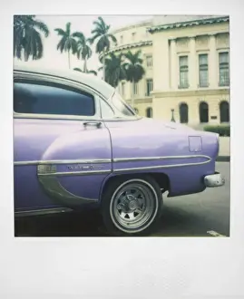 Polaroid Prints: Polaroid of profile of purple classic American car outside the Capitolio