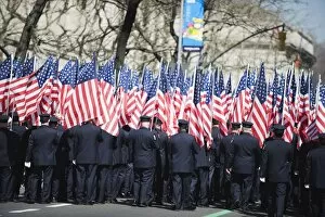 Police carrying American flags, St. Patricks Day celebrations on 5th Avenue