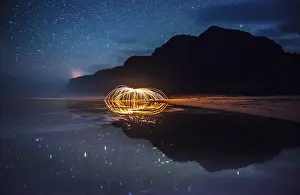 Spiral Galaxy Prints: Polihale State Park under a starry sky with sparks being reflected in a tidal pool