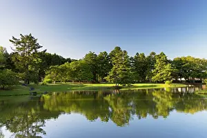 Aesthetics Prints: Pond at Kanjizaio-in Ato temple surrounded by trees and reflecting clear sky in Hiraizumi