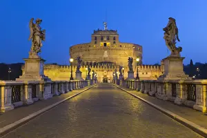 Ponte Sant Angelo with 16th century statues and the Castel Sant Angelo at night, Rome
