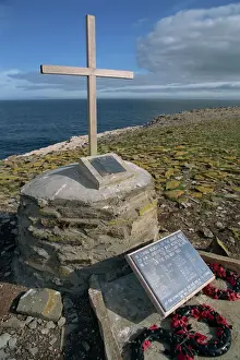 War Memorial Prints: Poppy wreaths laid on the 1982 War Memorial to the dead of HMS Sheffield on Sealion Island in the Falkland Islands