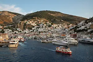 Glow Prints: The port and whitewashed houses on hillside at sunset