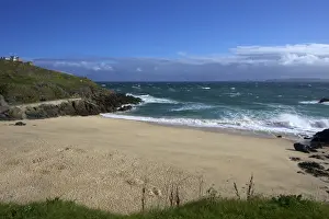 Porthgwidden beach in summer with storm approaching from the Atlantic, St