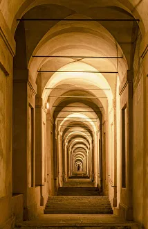 Portico Prints: The porticoes of Bologna, the longest in the world, night view of the arches towards